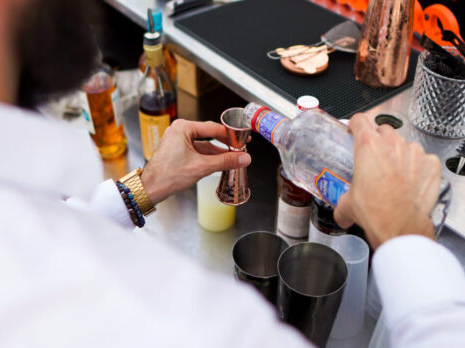 Barman preparing cocktails at Taste Corner’s live station during an event