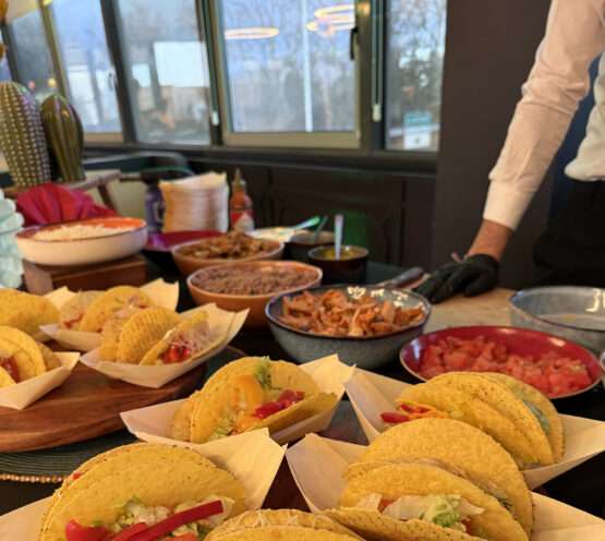 Chef preparing gourmet tacos at Taste Corner’s scenographic station during a catered event in South Florida