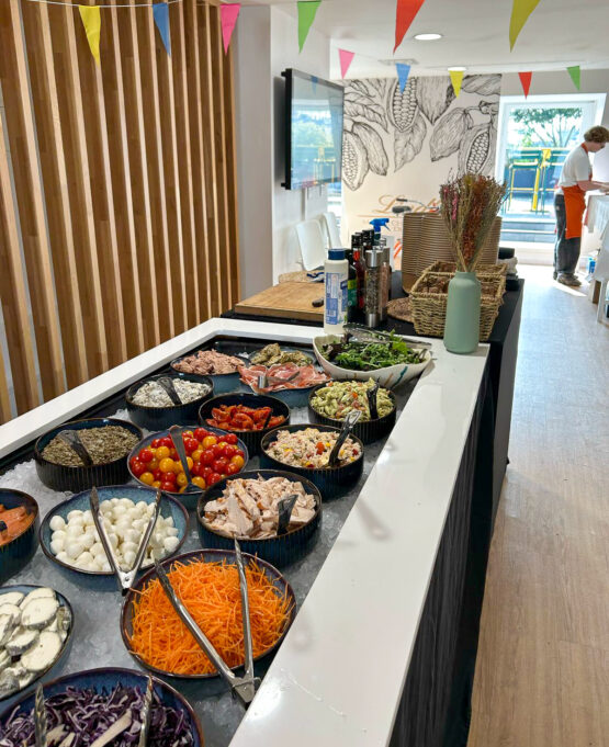 Salad station with assorted toppings and dressings at Taste Corner’s catered event in South Florida