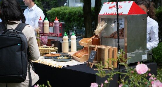 Chef preparing gourmet hotdogs at Taste Corner’s corporate event in South Florida
