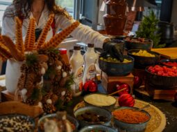 Chocolate fountain live station with chef preparing fresh fruit at Taste Corner event catering