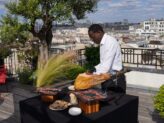 Chef carving premium ham at Taste Corner’s elegant rooftop station during a corporate event in South Florida