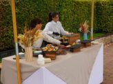Taste Corner blinis live station with two chefs preparing blinis at an event in South Florida