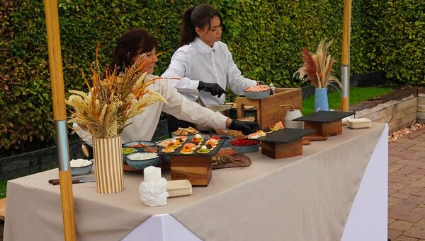 Taste Corner blinis live station with two chefs preparing blinis at an event in South Florida