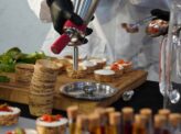 Chef preparing burrata live station at Taste Corner event catering in South Florida