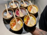 Customized smoothie bowls at Taste Corner’s live station during an event in South Florida