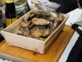 Chef preparing fresh oysters at Taste Corner’s oyster station during a catered event in South Florida