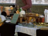 Chef preparing pancakes at Taste Corner’s live station with toppings for event catering in South Florida