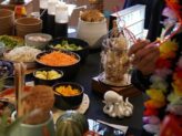 Poke bowl station with Hawaiian decor and fresh toppings at Taste Corner’s catered event in South Florida