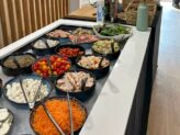Salad station with assorted toppings and dressings at Taste Corner’s catered event in South Florida